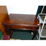 A SMALL WALNUT FOLD OVER CARD TABLE.