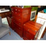 A PAIR OF BEDSIDE CABINETS AND MATCHING TALL CHEST.
