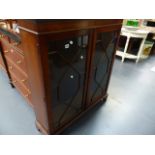 A GLAZED MAHOGANY BOOKCASE.