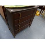 AN OAK CHEST OF DRAWERS AND A STANDARD LAMP