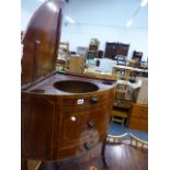 A REGENCY MAHOGANY CORNER WASHSTAND.