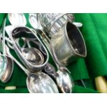 VARIOUS SILVER NAPKIN RINGS, TEASPOONS AND OTHER CUTLERY.