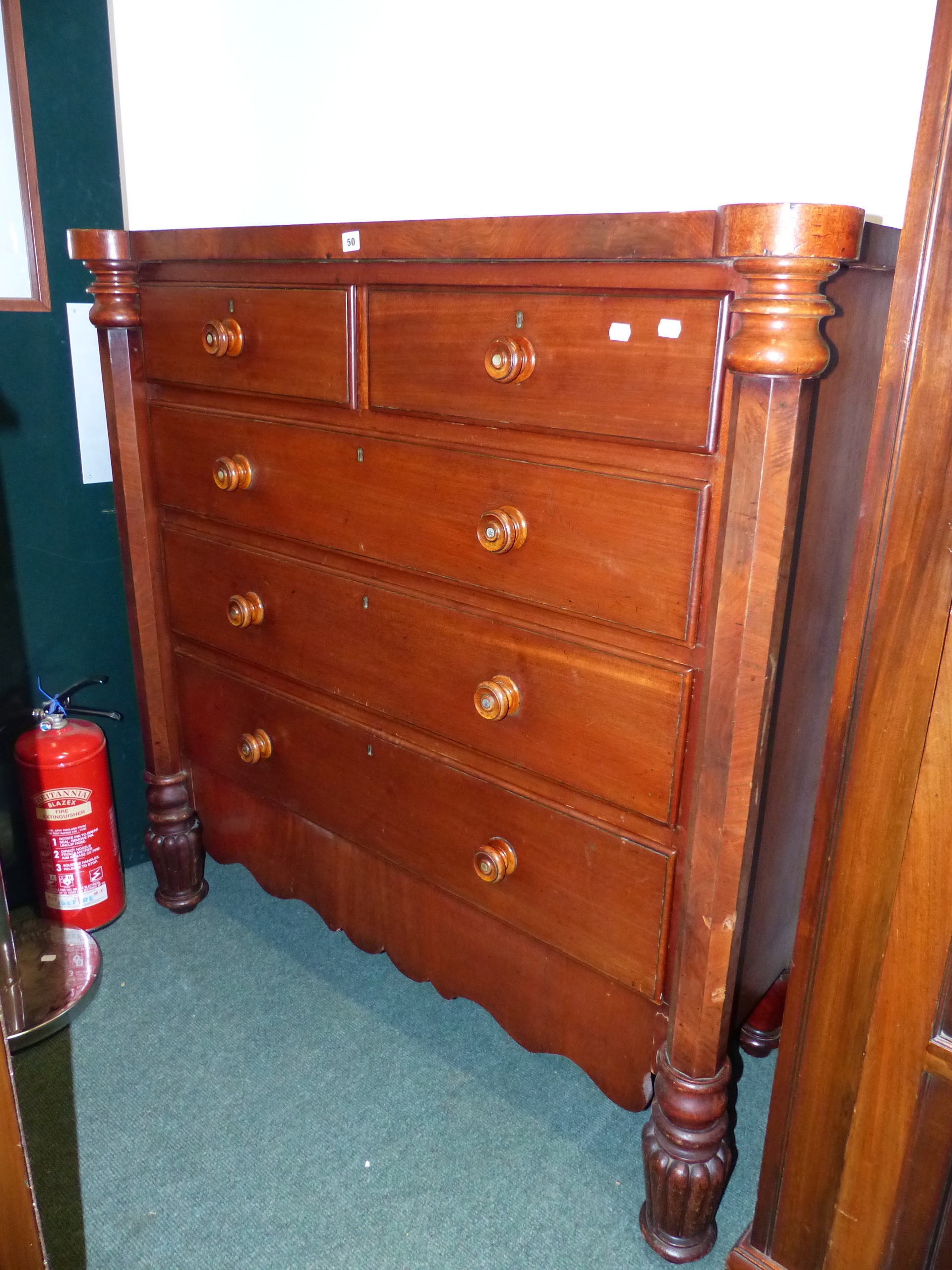 A LARGE MAHOGANY CHEST OF DRAWERS.