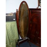 A MAHOGANY FRAMED CHEVAL MIRROR.