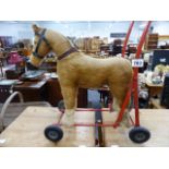 A VINTAGE PUSHALONG HORSE.