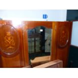 AN EDWARDIAN INLAID MAHOGANY WARDROBE.