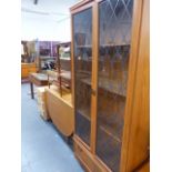 A DROP LEAF DINING TABLE AND A DISPLAY CABINET.