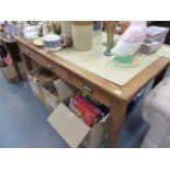 AN OAK THREE DRAWER WRITING TABLE.