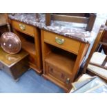 A PAIR OF CONTINENTAL BEDSIDE CABINETS.