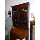 AN EDWARDIAN BUREAU BOOKCASE.