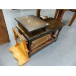 A TELEPHONE TABLE AND A SMALL RUG.