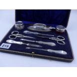 A NINE PIECE SILVER HALLMARKED MANICURE SET, DATED 1923 BIRMINGHAM.