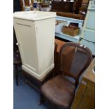 A ROCKING CHAIR, BEDSIDE CABINET AND A SMALL ELM CHAIR.