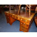 A TWIN PEDESTAL DESK.