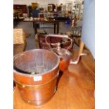 A LARGE COPPER KETTLE AND A PLANTER