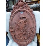 A LARGE TERRA COTTA WALL PLAQUE.
