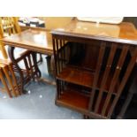 AN EDWARDIAN REVOLVING BOOKCASE AND A WALNUT OCCASIONAL TABLE.