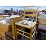 AN ERCOL CORNER CABINET AND A LADDER BACK CHAIR.