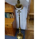 A BRASS STANDARD LAMP.