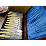 A SET OF PLATED FISH CUTLERY.AND A SMALL MAHOGANY CORNER CABINET