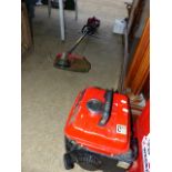 A PETROL STRIMMER AND A SMALL GENERATOR.