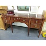 A GEORGIAN MAHOGANY BOW FRONT SIDEBOARD.