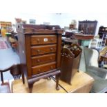 A SMALL MAHOGANY TRAY TOP CHEST AND AN OAK MAGAZINE RACK.