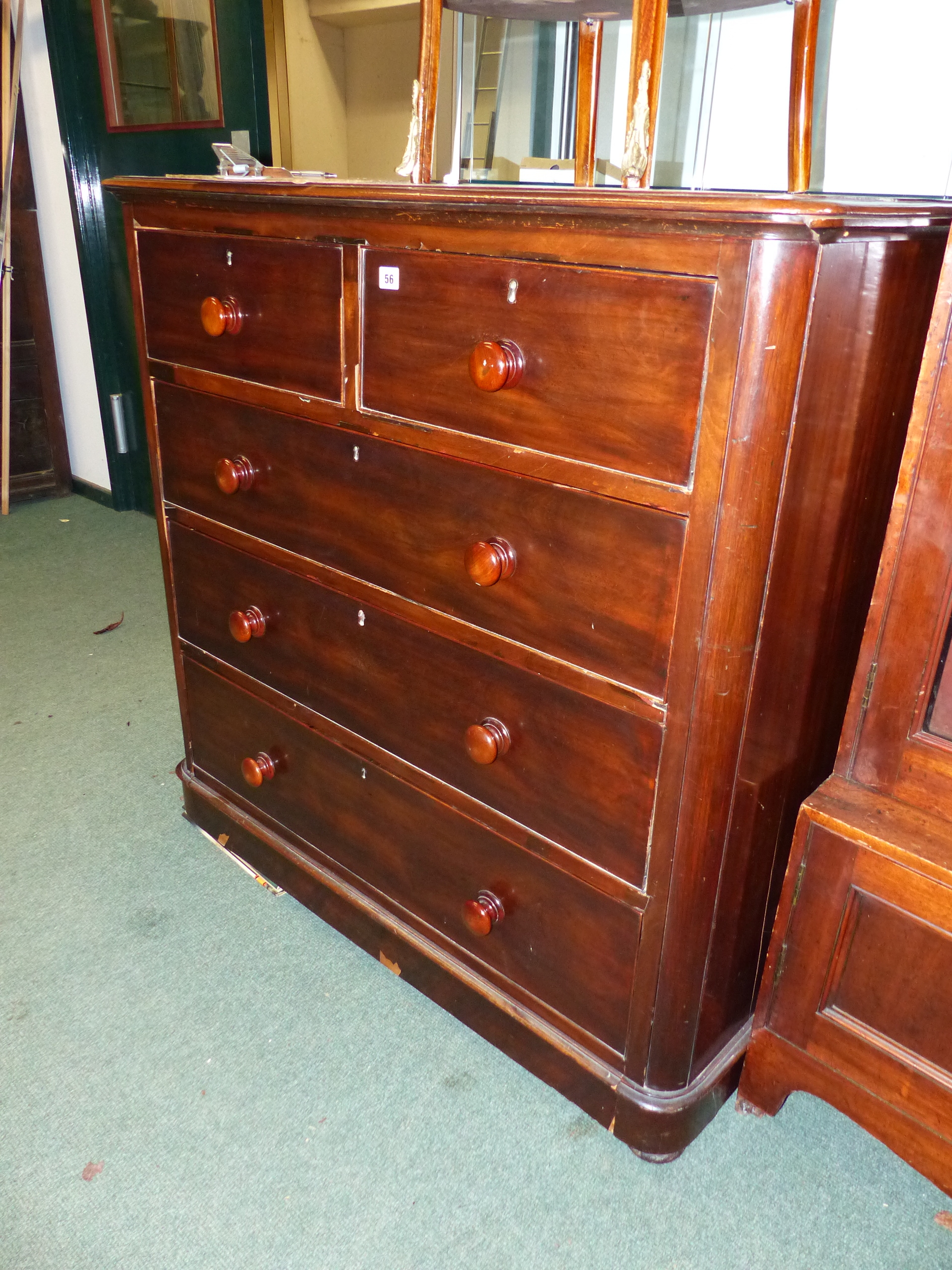 A VICTORIAN MAHOGANY CHEST OF DRAWERS.