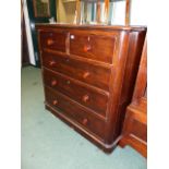 A VICTORIAN MAHOGANY CHEST OF DRAWERS.