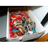 A BOX OF COSTUME JEWELLERY.