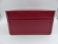 A RED LEATHER CARTIER DOUBLE LAYERED JEWELLERY CASE.