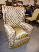 AN UNUSUAL BUTTON UPHOLSTERED HIGH BACK ARMCHAIR.