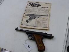 A .177 HAENEL MOD.28-R AIR PISTOL, TWO PIECE WOODEN GRIPS WITH BRASS HAENEL INSERTS.