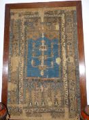 AN EARLY TURKISH PRAYER RUG OF CLASSICAL DESIGN MOUNTED IN A LATER FRAME. OVERALL H.48 x OVERALL W.