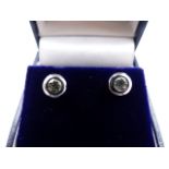 A PAIR OF WHITE METAL RUBOVER SET DIAMOND STUD EARRINGS. APPROXIMATE ESTIMATED DIAMOND WEIGHT 0.