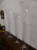 TWO NEAR PAIRS OF CLEAR GLASS TALL LILY VASES. LARGEST H.120cms. (4)