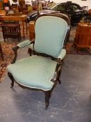 A PAIR OF FRENCH LOUIS XV STYLE CARVED ARMCHAIRS WITH SHAPED BACKS AND SEATS.