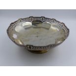 A SILVER FOOTED BOWL WITH PIERCED DECORATION, APPROXIMATE WEIGHT 577grms, APPROXIMATE DIAMETER 24.