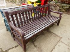 A LARGE TEAK GARDEN BENCH. c.1958