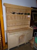 AN ANTIQUE PAINTED PINE COUNTRY KITCHEN DRESSER WITH PLATE RACK OVER. W.146 x H.189cms.