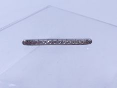 A FRENCH PLATINUM DIAMOND BAR BROOCH, WITH A DOGS HEAD HALLMARK DENOTING ITEMS MADE IN FRANCE FOR