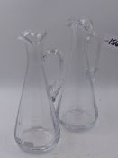 A PAIR OF WILLIAM YEOWARD CLEAR GLASS WINE EWERS. H.31cms.