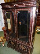 AN ANTIQUE CONTINENTAL INLAID DISPLAY CABINET OF SPANISH/ MOROCCAN DESIGN. GLAZED UPPER SECTION