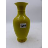 A CHINESE YELLOW GROUND BALUSTER VASE WITH INCISED DECORATION. H.22cms.