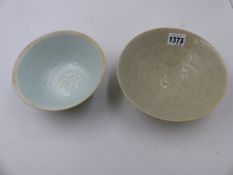 TWO EARLY CHINESE CELADON GLAZE BOWLS BOTH WITH INCISED DECORATION. LARGEST Dia. 17.5cms.