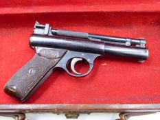 A WEBLEY SENIOR AIR PISTOL CONTAINED IN A CANVAS WEBLEY TYPE CASE.