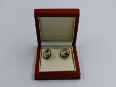 A PAIR OF HAND PAINTED JAPANESE SATSUMA BUTTONS REMODELLED INTO DROP EARRINGS USING 9ct YELLOW GOLD.