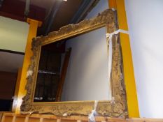 A LARGE 19th.C.ROCOCO STYLE GILT FRAME, THE REBATE H.102 x W.127cms.