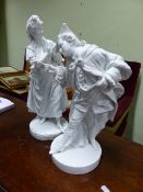 A PAIR OF CONTINENTAL WHITE GLAZED FIGURES OF A DANDY AND BEAR. H.47cms.