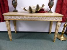 A PAIR OF CARVED AND PAINTED ITALIANATE PIER TABLES WITH ANTHEMION DECORATED FRIEZE WITH GILT